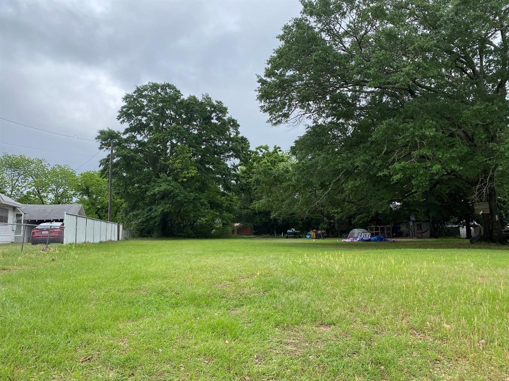 0 Goodwill Street Minden, LA 71055 - Photo 2 of 5 a view of a field with a trees in the background