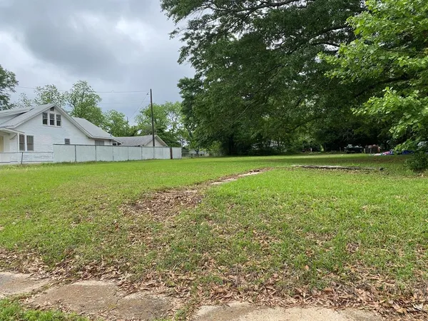 a view of a field with a big yard