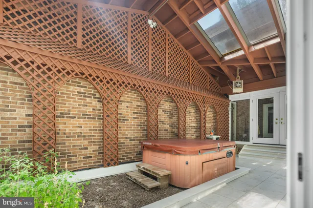 a view of staircase with wooden floor and a window