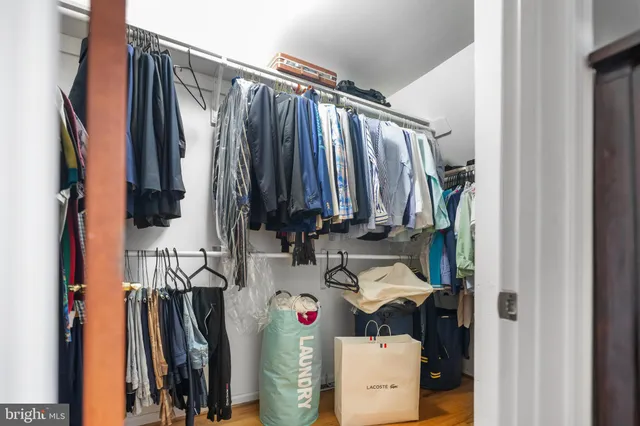 a bedroom with a bed and a chair