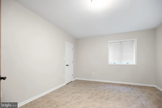 a stove top oven sitting inside of a kitchen