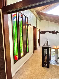 a bedroom with a large bed and large window