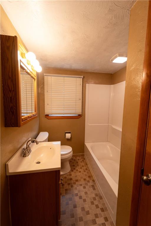 199 Spruce Street Mount Pleasant, PA 15666 - Photo 18 of 23 a bathroom with a sink a toilet and bathtub