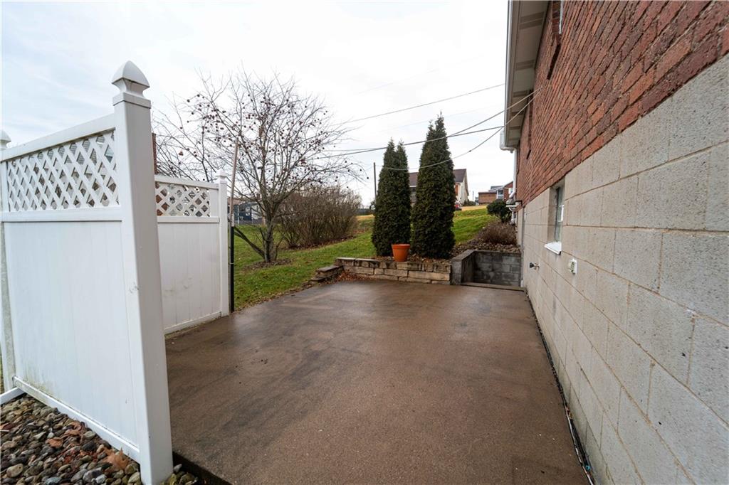 199 Spruce Street Mount Pleasant, PA 15666 - Photo 5 of 23 a view of a street with wooden fence