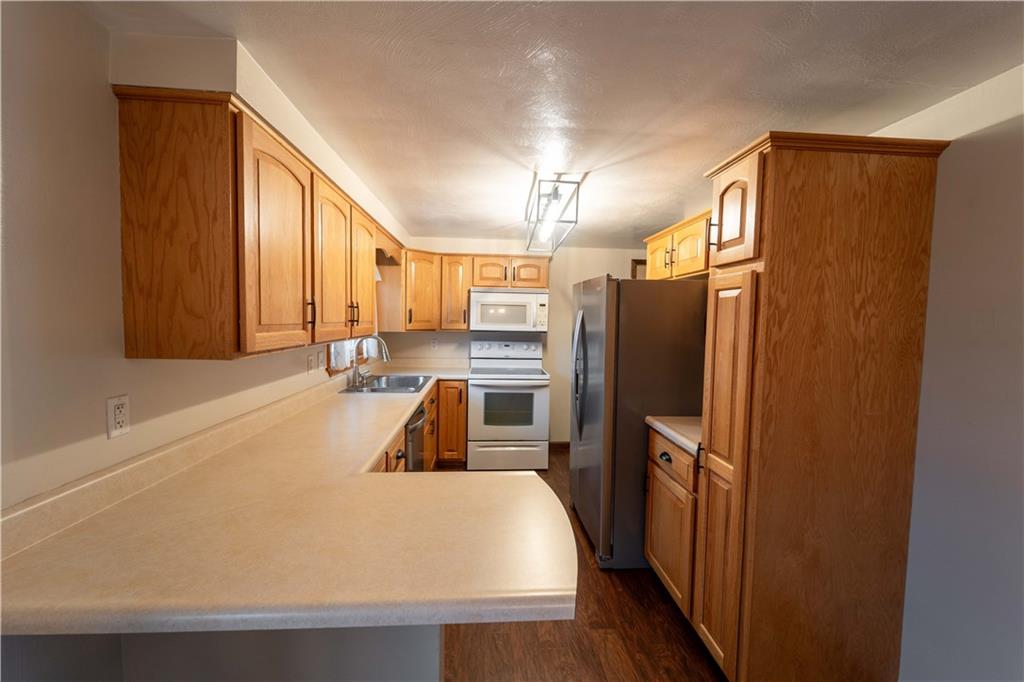 199 Spruce Street Mount Pleasant, PA 15666 - Photo 9 of 23 a large white refrigerator freezer sitting in a kitchen