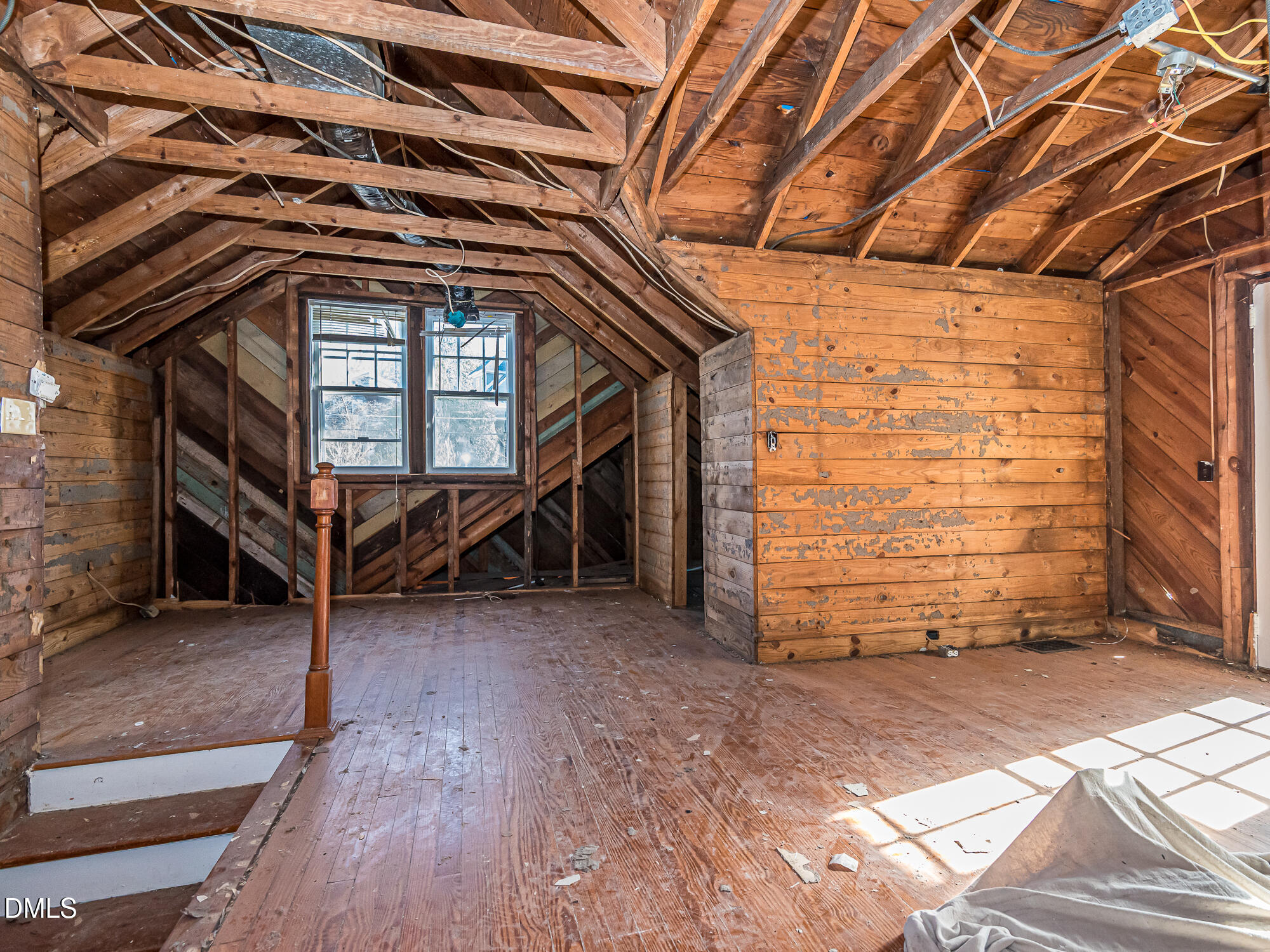 1825 White Oak Road Raleigh, NC 27608 - Photo 20 of 35 a view of an empty room with wooden floor and a window