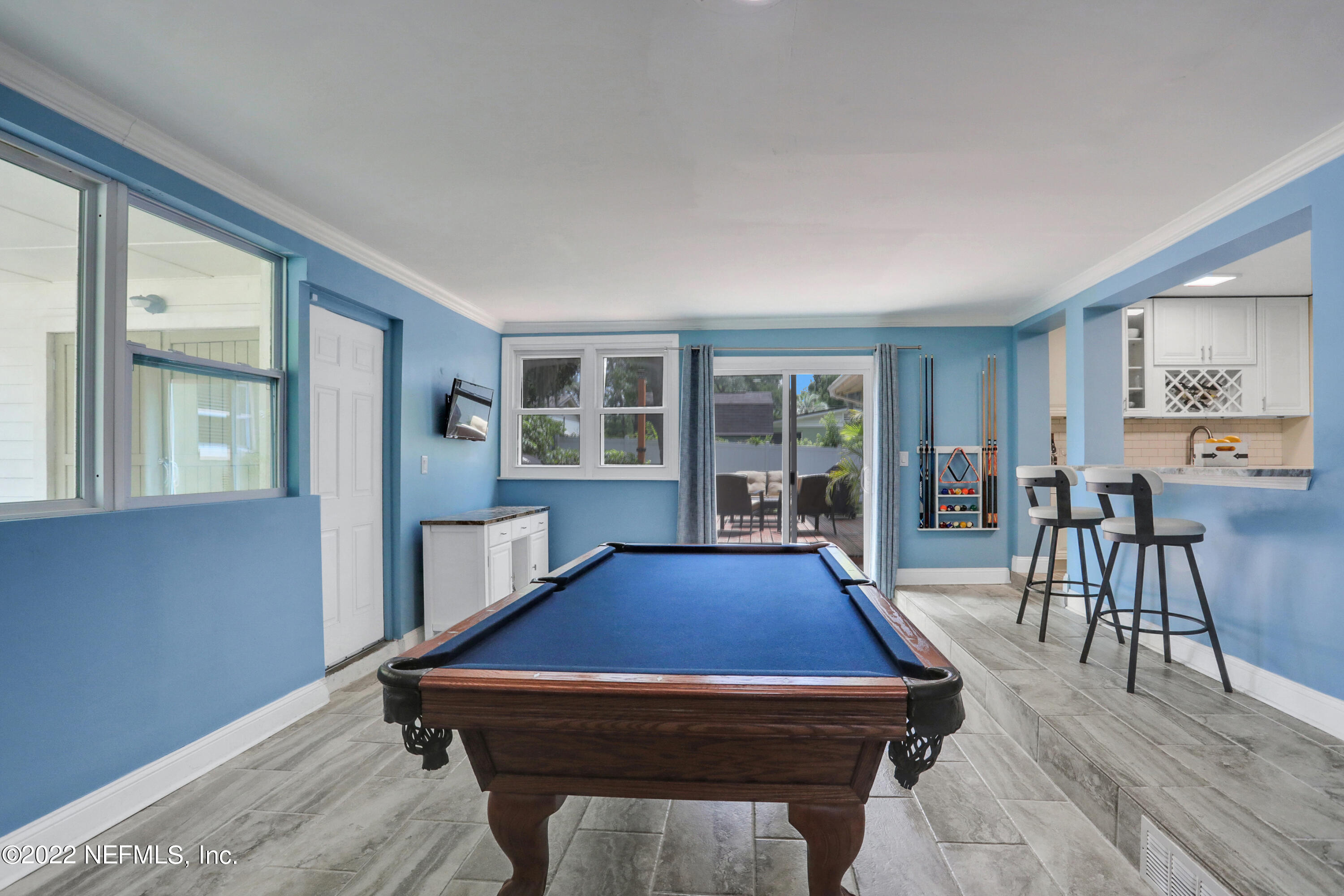 6435 Temple Road Jacksonville, FL 32217 - Photo 3 of 38 a room with pool table and windows