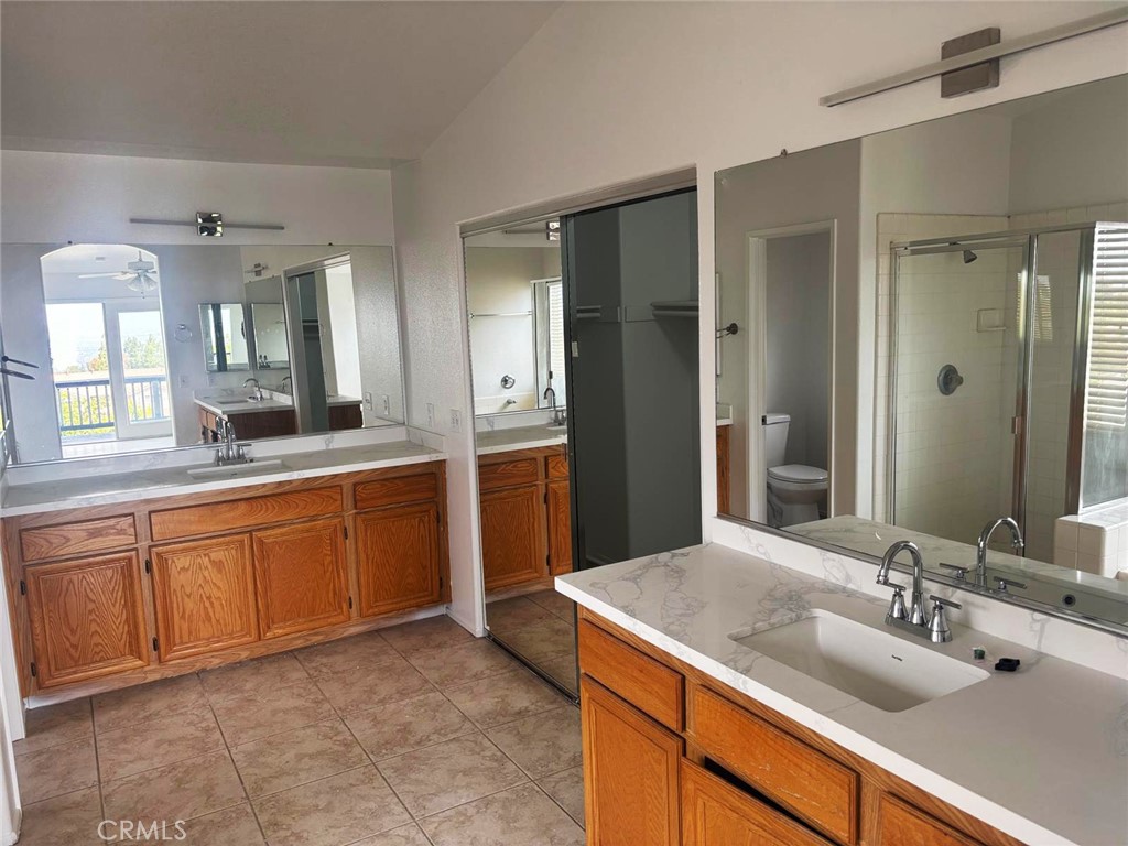 731 Raphael Circle Corona, CA 92882 - Photo 12 of 28 a bathroom with a sink and a mirror
