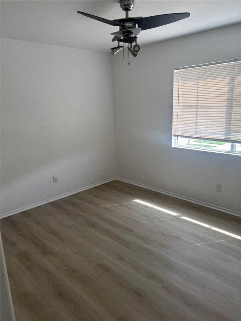 731 Raphael Circle Corona, CA 92882 - Photo 20 of 28 wooden floor in an empty room with a window