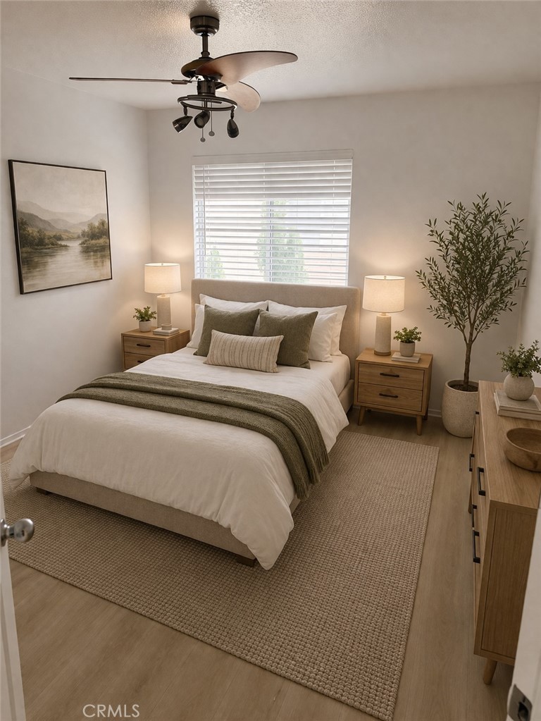 731 Raphael Circle Corona, CA 92882 - Photo 21 of 28 a bedroom with a bed and a chandelier