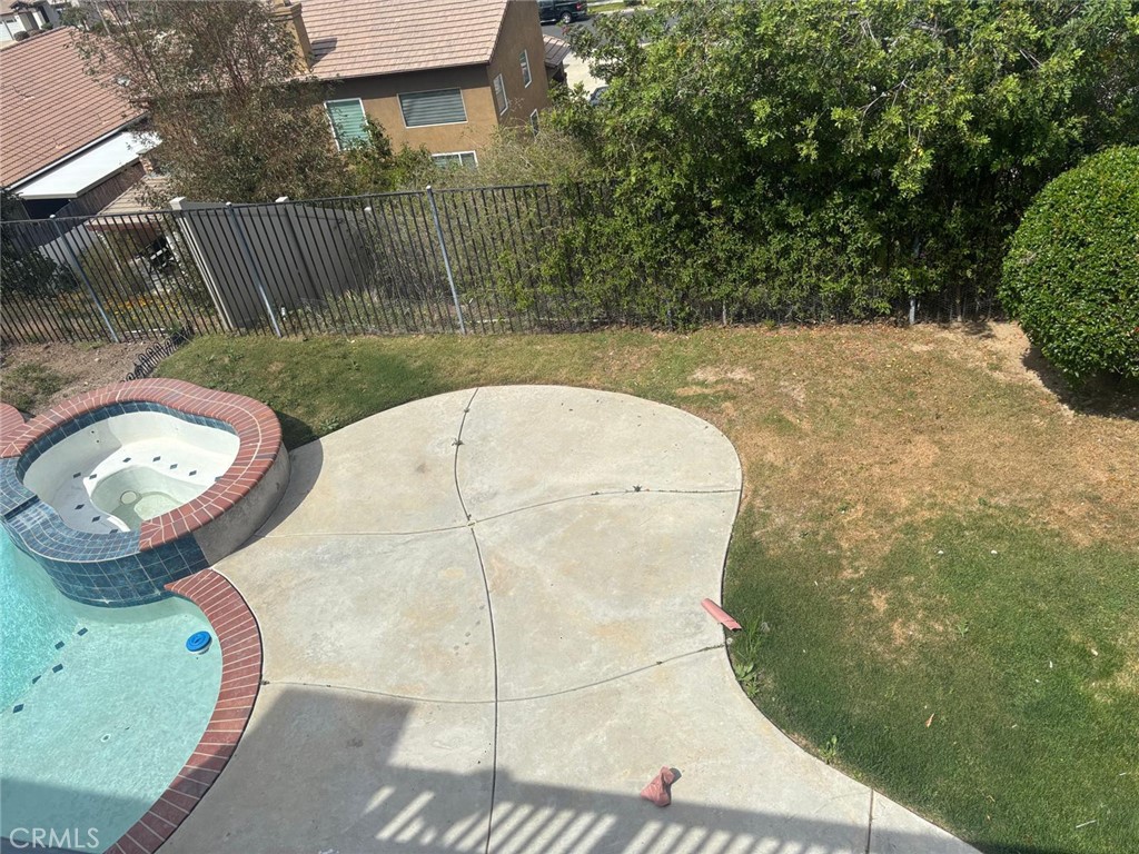 731 Raphael Circle Corona, CA 92882 - Photo 23 of 28 a view of a swimming pool with a backyard