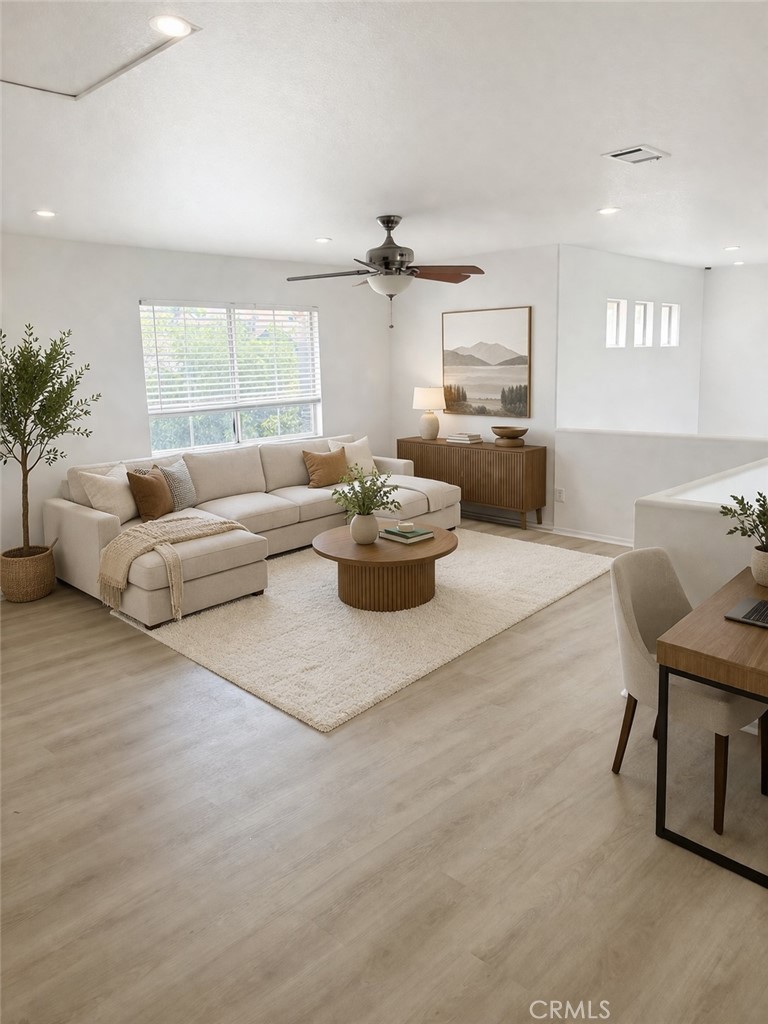 731 Raphael Circle Corona, CA 92882 - Photo 27 of 28 a living room with furniture and a large window