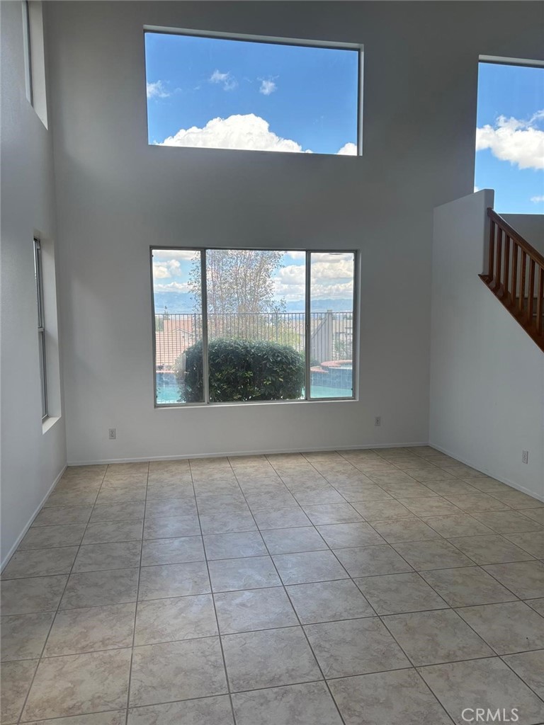 731 Raphael Circle Corona, CA 92882 - Photo 3 of 28 a view of an empty room with a window