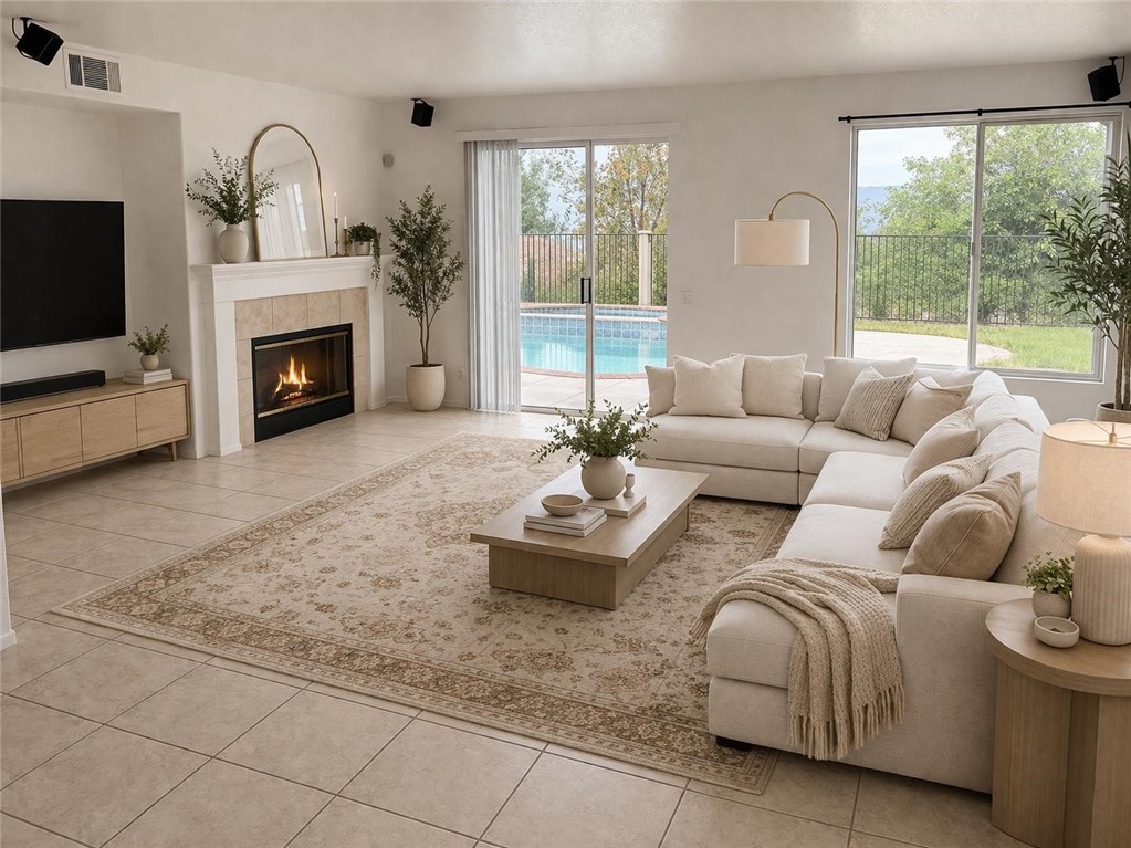 731 Raphael Circle Corona, CA 92882 - Photo 10 of 28 a living room with furniture large window and a fireplace