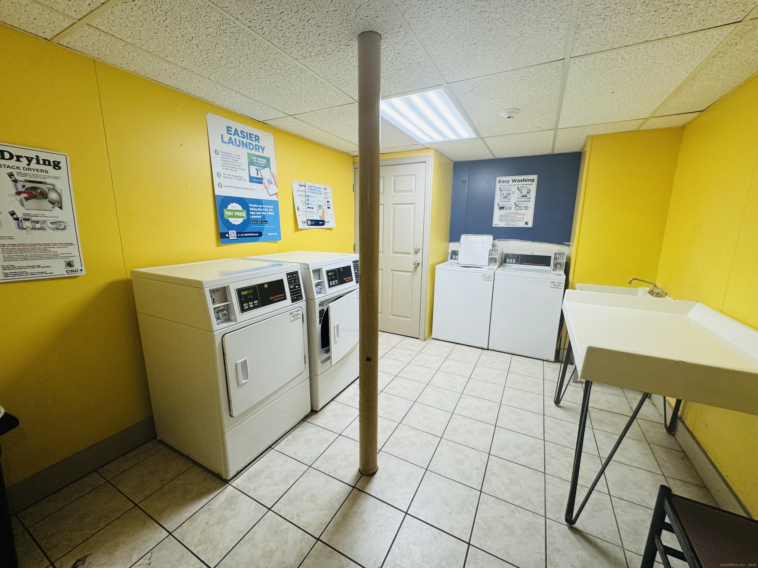 304 Pine Rock Avenue, Unit C15 Hamden, CT 06514 - Photo 14 of 14 a utility room with dryer and washer