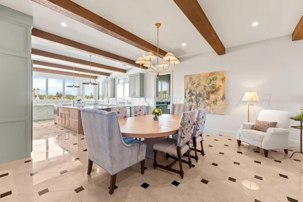 a kitchen with stainless steel appliances kitchen island granite countertop a sink and cabinets