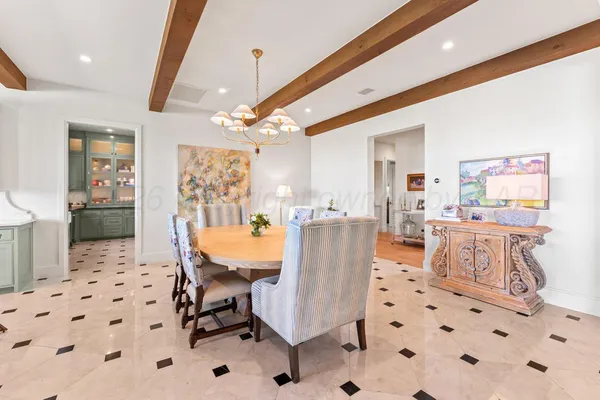 a kitchen with stainless steel appliances white cabinets and a window