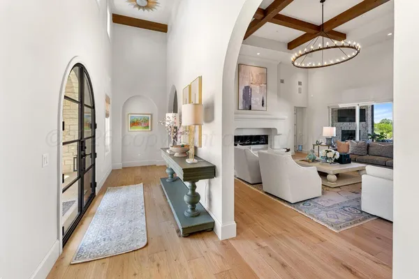 a living room with furniture a rug and a fireplace