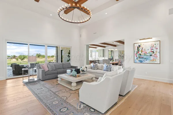 a view of living room with furniture and floor to ceiling window
