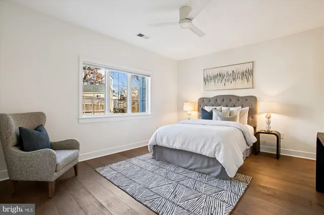 a bathroom with a double vanity sink a mirror and a bathtub