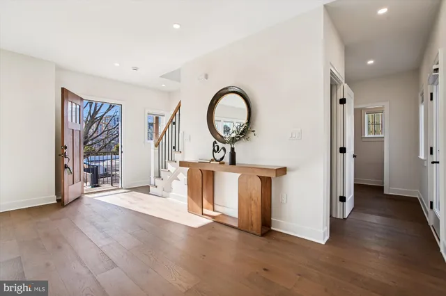 a living room with furniture and large window