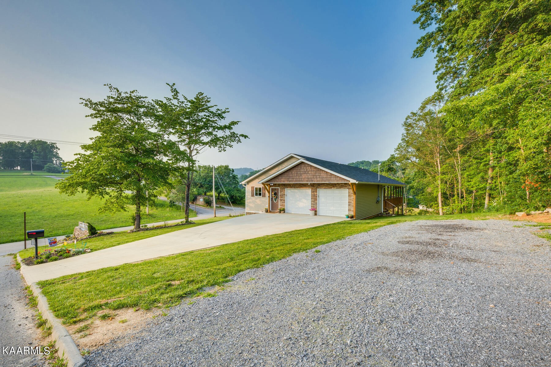 117 Cherokee Cove Rutledge, TN 37861 - Photo 31 of 43 a front view of a house with a yard and trees