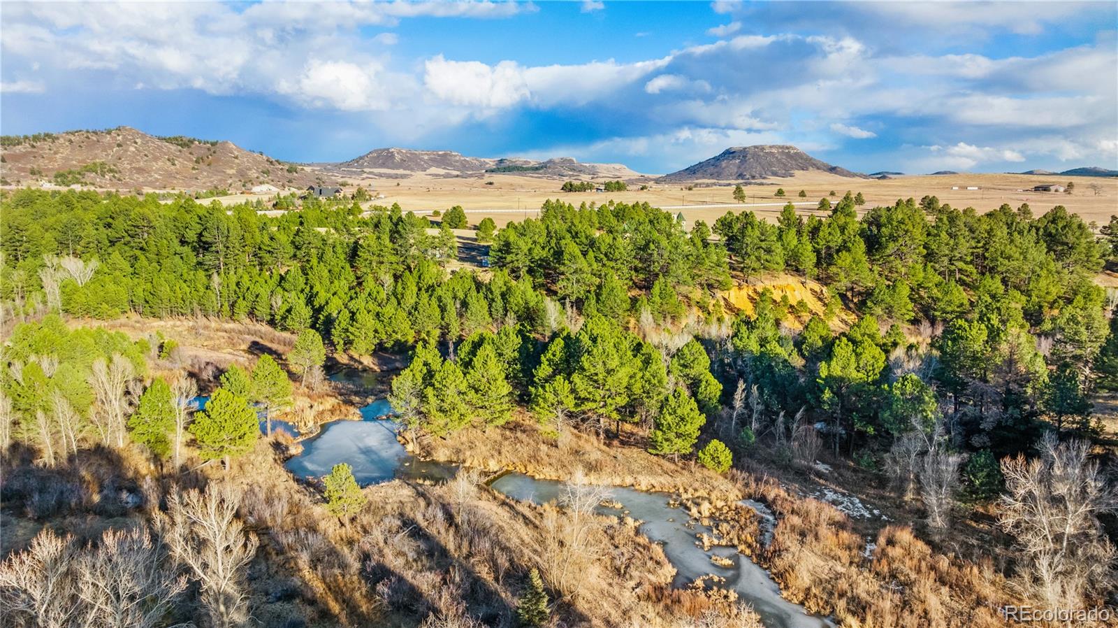 436 West Fox Farm Road Larkspur, CO 80118 - Photo 32 of 50 a view of a city with a mountain