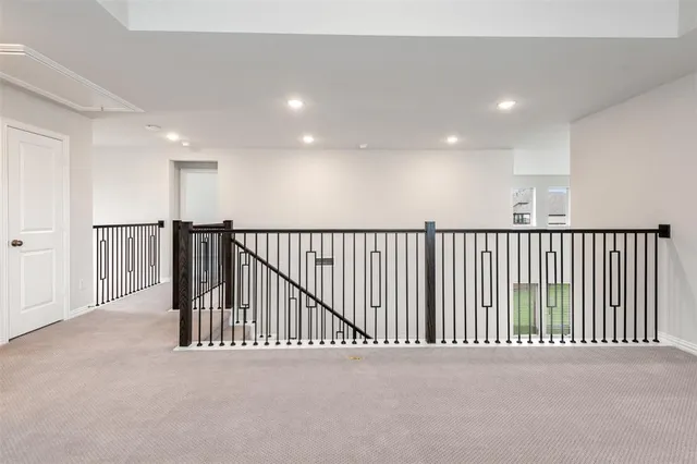 a view of a hallway with a livingroom