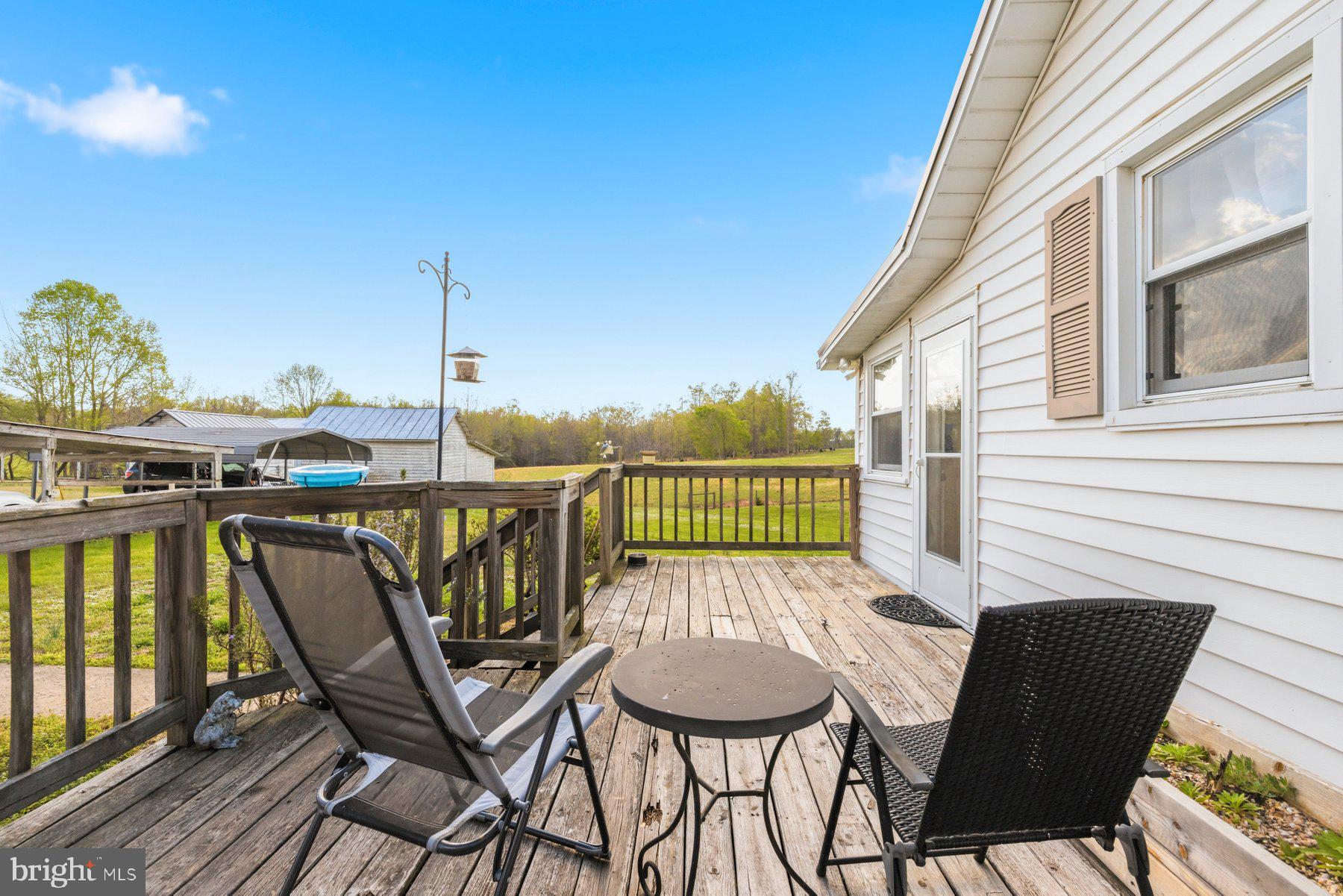 2092 Rocksprings Road Ringgold, VA 24586 - Photo 11 of 84 a view of a chairs and table on the deck