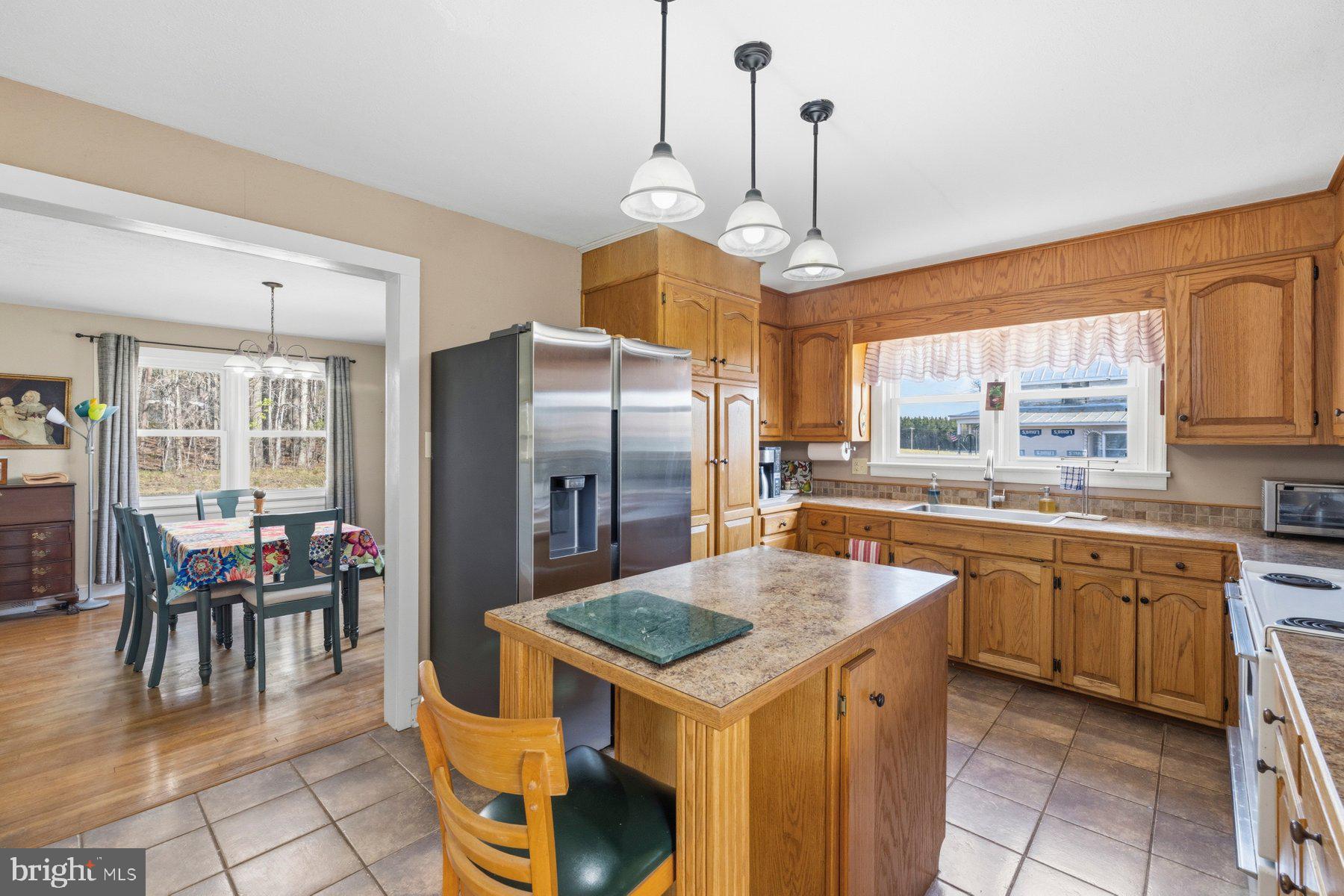 2092 Rocksprings Road Ringgold, VA 24586 - Photo 20 of 84 a kitchen with stainless steel appliances granite countertop a sink a stove and a refrigerator