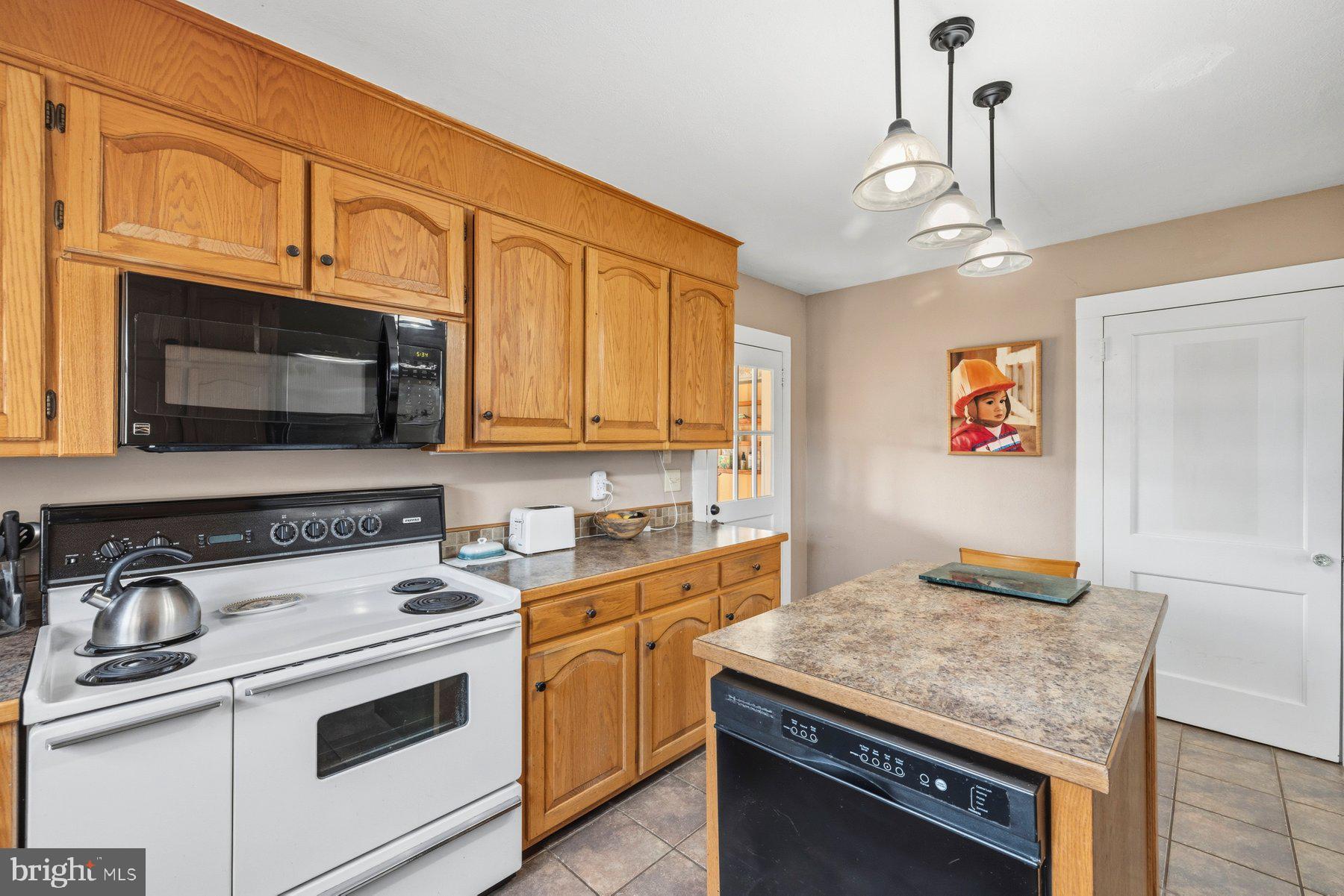 2092 Rocksprings Road Ringgold, VA 24586 - Photo 22 of 84 a kitchen with stainless steel appliances granite countertop a stove and a microwave