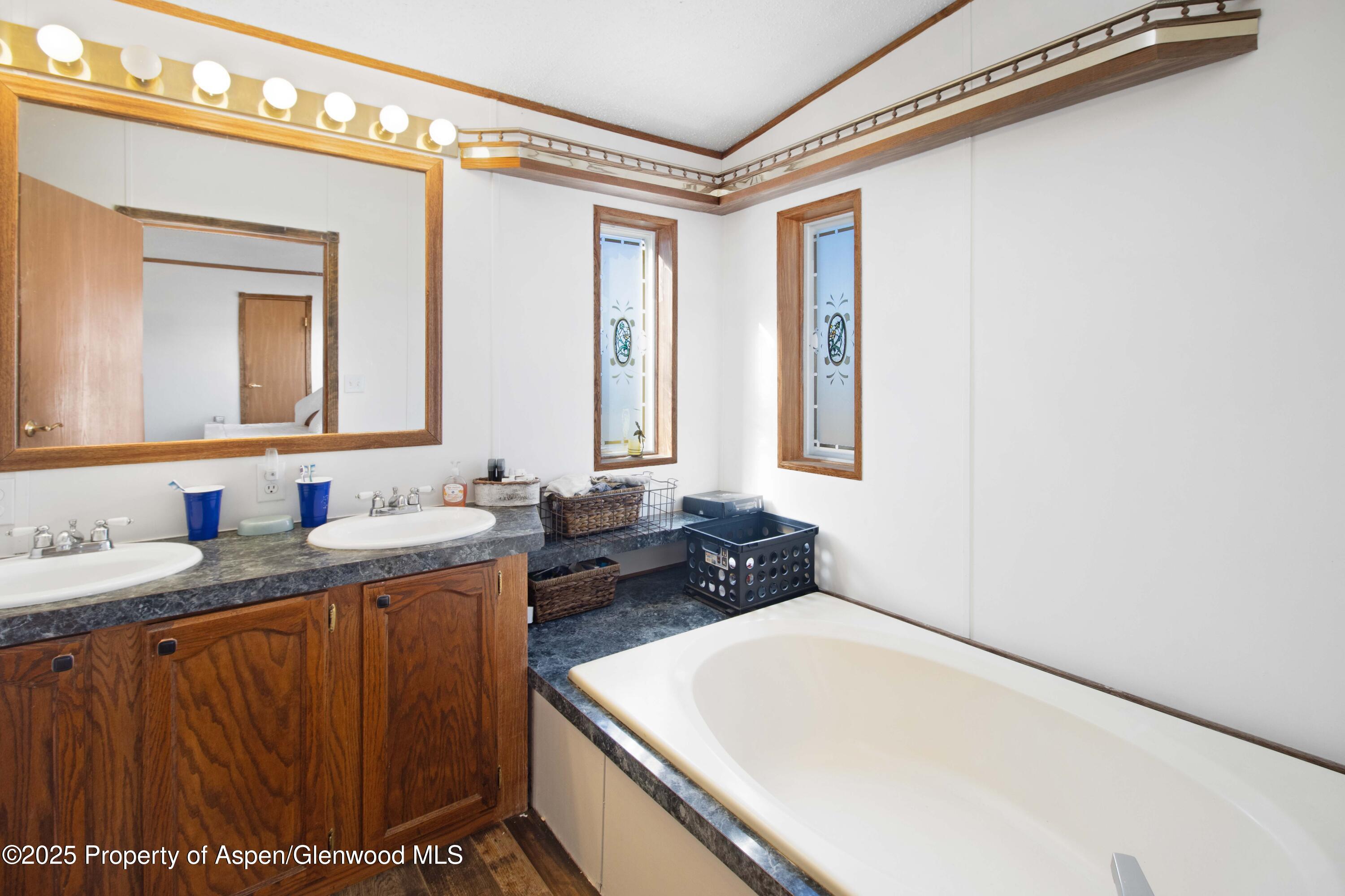 260 Lazy S Reverse Drive Silt, CO 81652 - Photo 13 of 30 a bathroom with a sink and a mirror