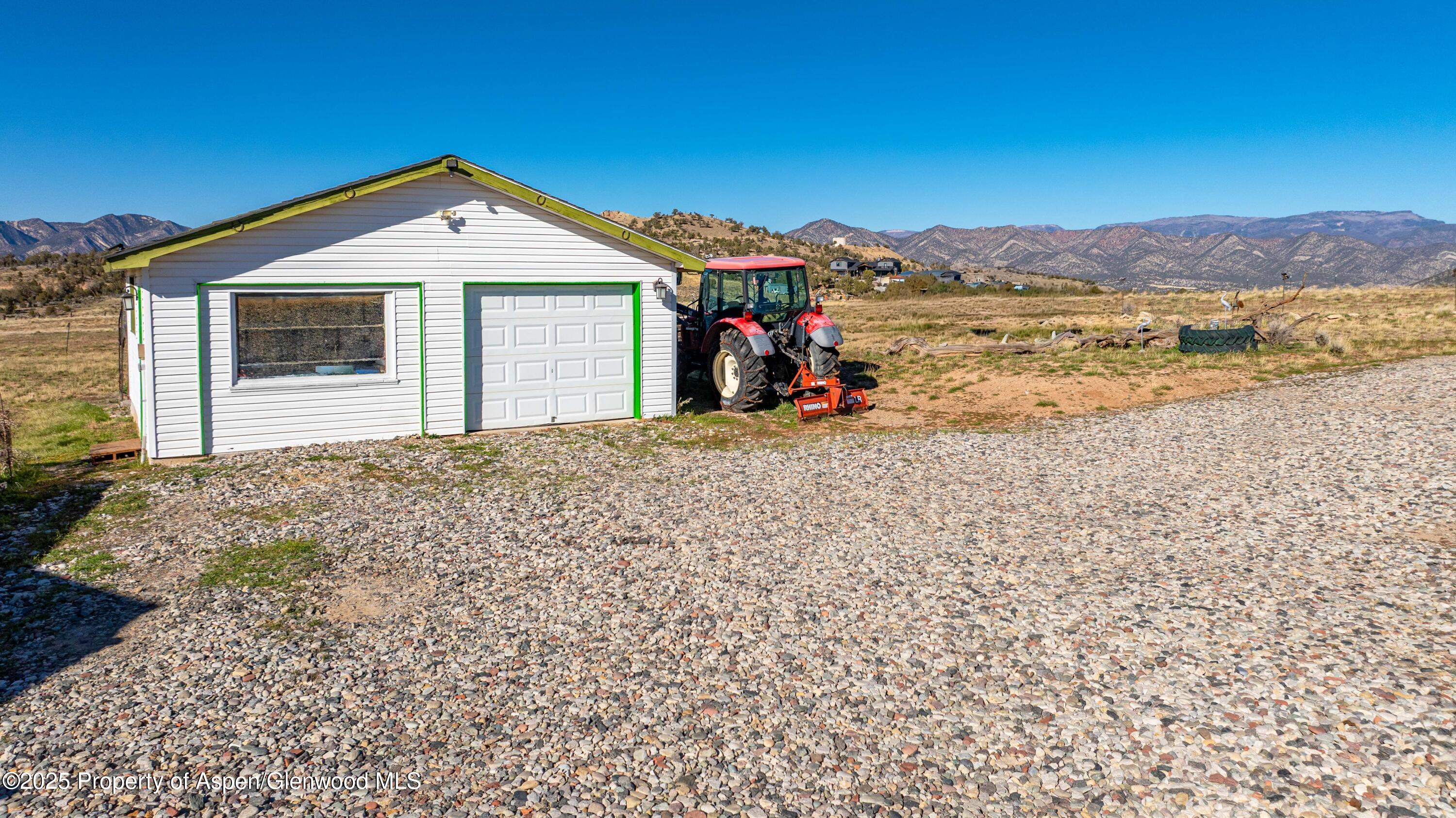 260 Lazy S Reverse Drive Silt, CO 81652 - Photo 18 of 30 a front view of a house with a yard