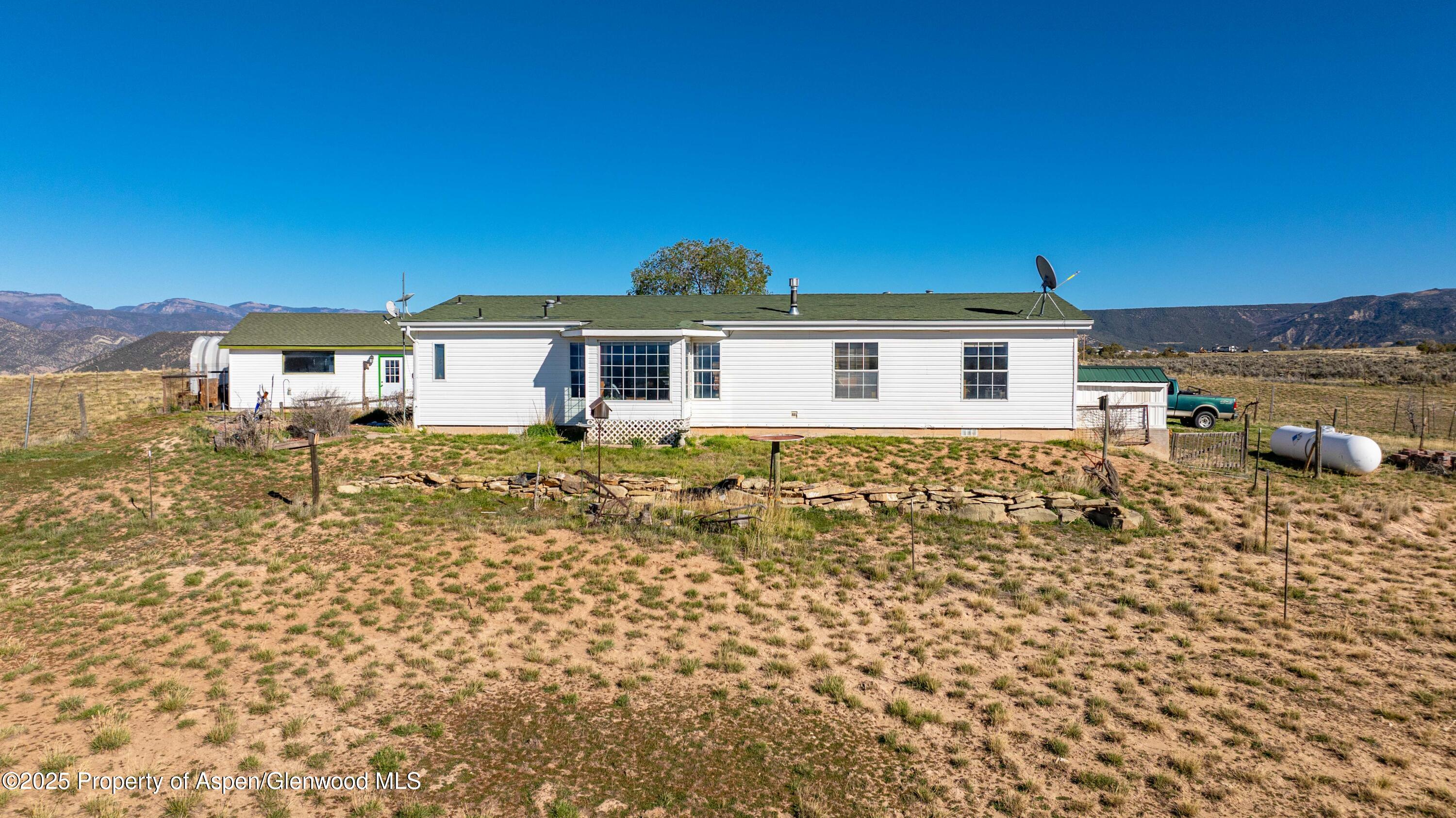 260 Lazy S Reverse Drive Silt, CO 81652 - Photo 24 of 30 a front view of a house with a yard