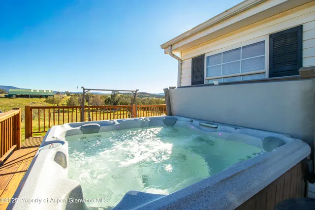 a view of a swimming pool with an outdoor seating