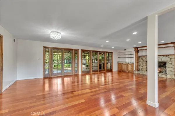 a view of an entryway with wooden floor