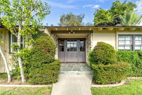 front view of a house with a small yard