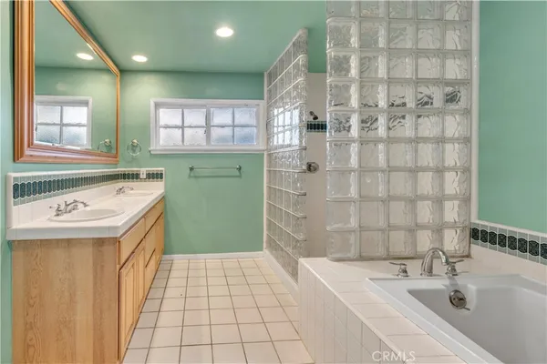 a white toilet sitting next to a bath tub