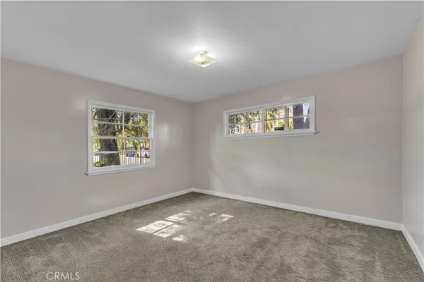 a kitchen with stainless steel appliances granite countertop a sink a stove and a wooden floors