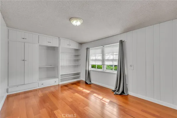 a view of a porch with a table and chairs and potted plants