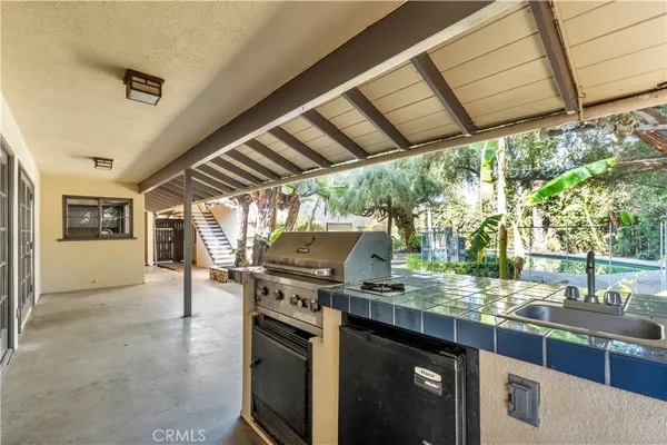 a view of a swimming pool with some potted plants
