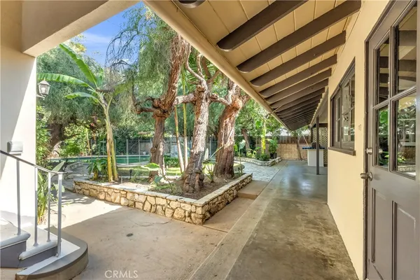 a view of a swimming pool with a patio