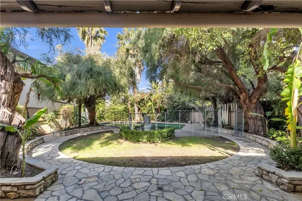 a view of a back yard of the house