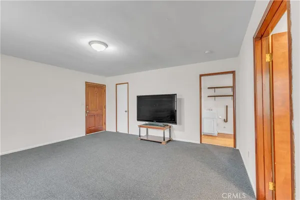 a view of a house with a small yard and plants