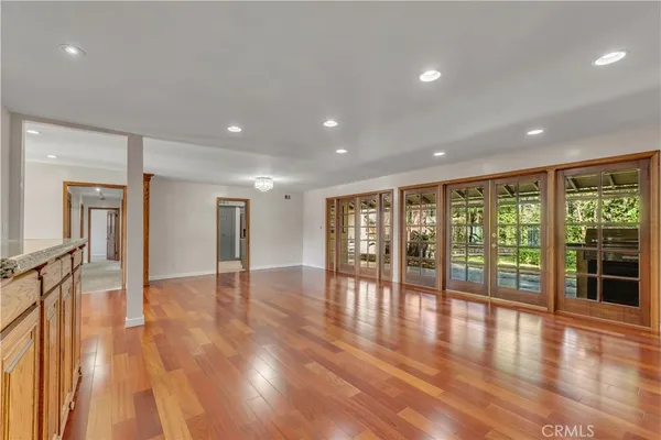 a view of an entryway with wooden floor