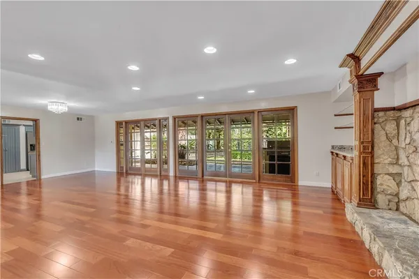 a view of an entryway with wooden floor and door