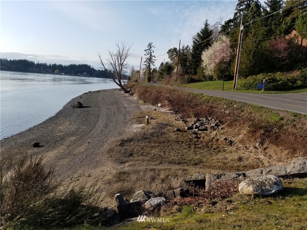 0 Tracyton Beach Road Northwest Bremerton, WA 98310 - Photo 5 of 6 a view of a lake with a mountain and trees