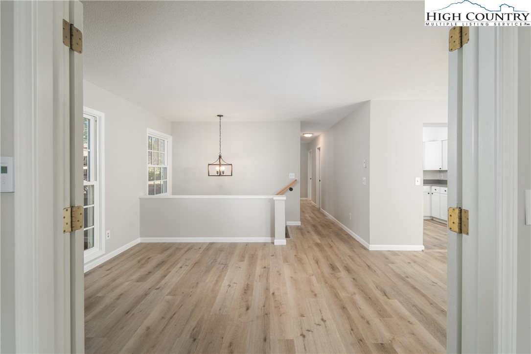 553 Hardaman Circle Boone, NC 28607 - Photo 8 of 42 a view of wooden floor and windows in a room
