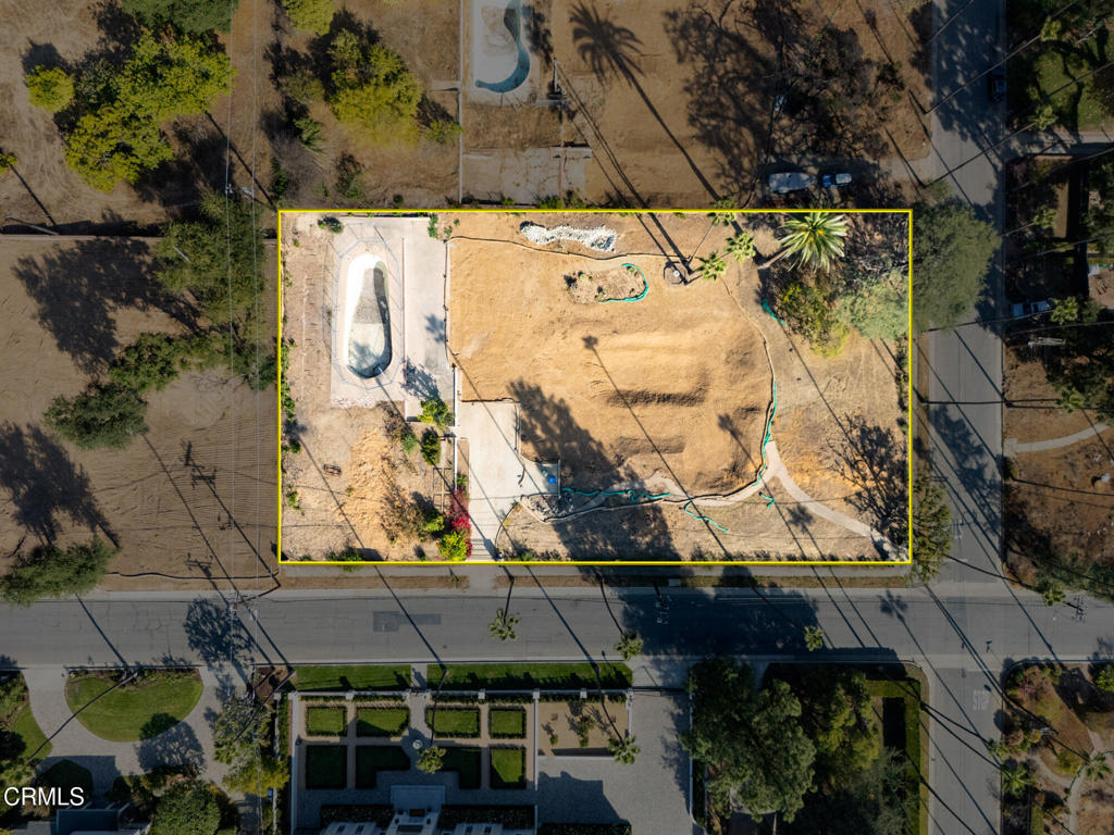 an aerial view of house with a yard