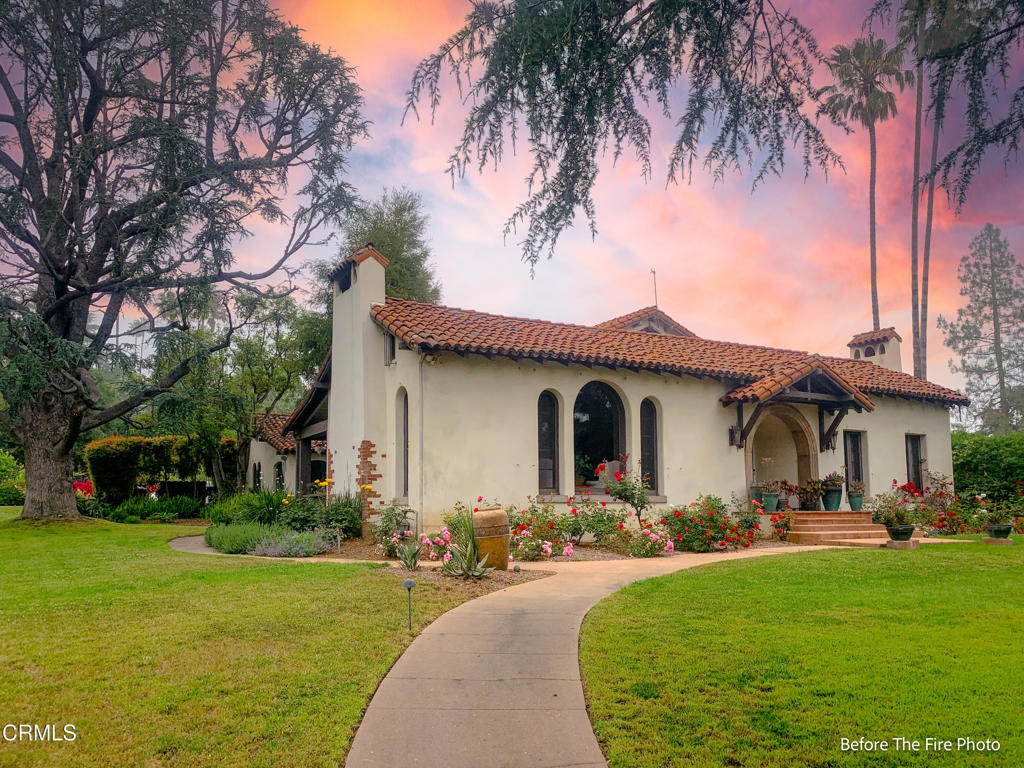 1625 Braeburn Road Altadena, CA 91001 - Photo 4 of 30 a front view of a house with a garden and yard